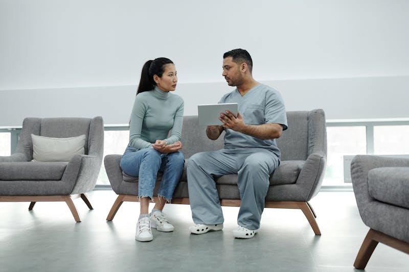 Doctor discussing treatment plan with pain management patient