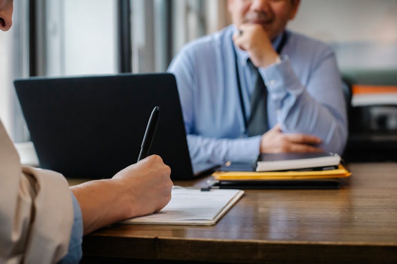 Professional reviewing compliance documents and administrative requirements